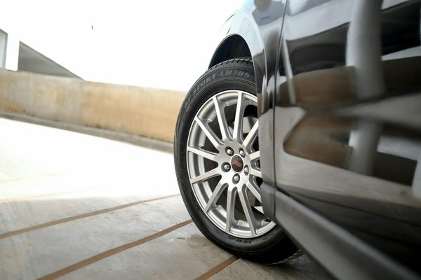 How can you protect your car's paint job from scratches and environmental damage?